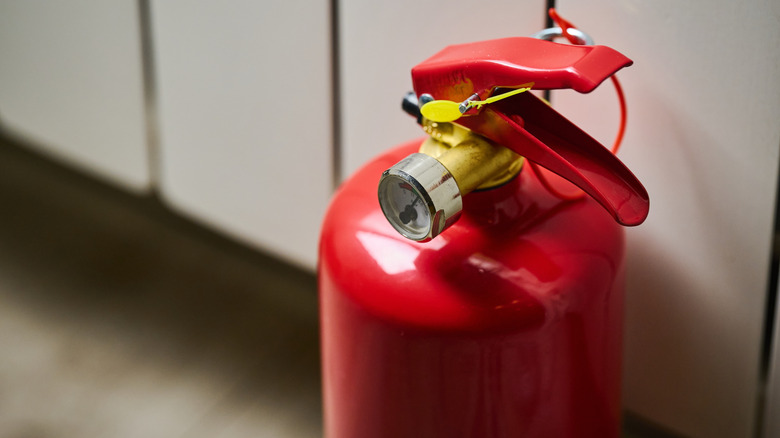 A red fire extinguisher