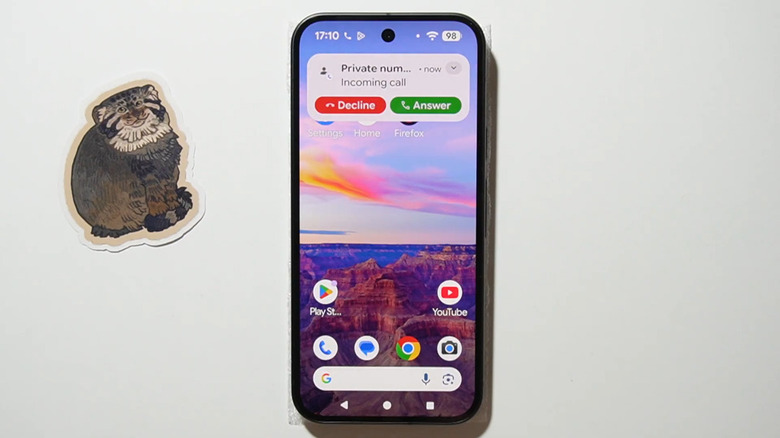 Google Pixel phone on a table receiving a call.