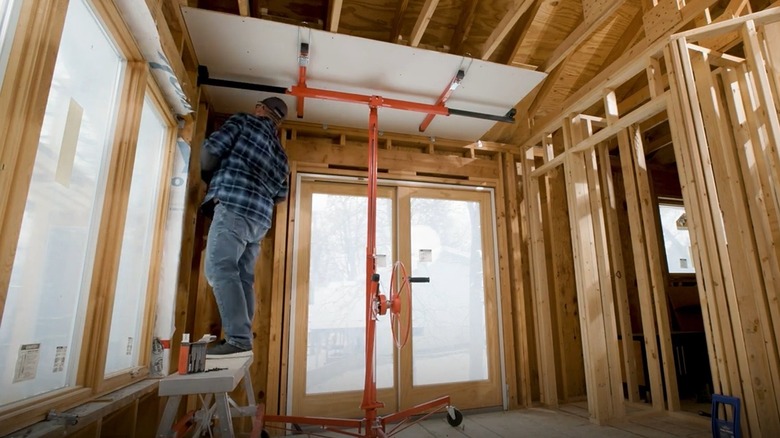 Man using drywall lift