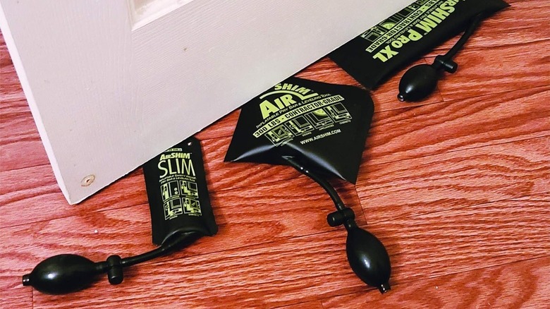 Three air shims under a door