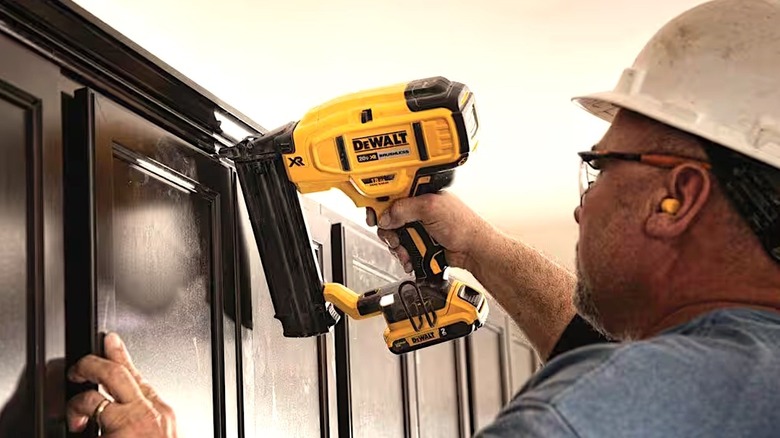 Person using DeWalt tool powered with 2.0 Ah battery