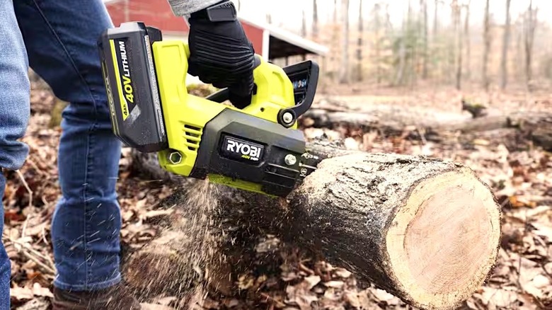 Person using Ryobi tool powered by 4.0 Ah battery