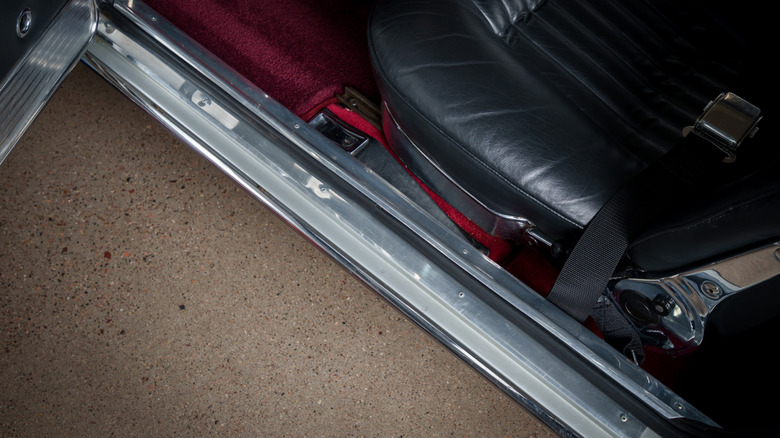 A metal door sill on the driver's side