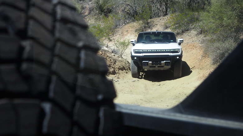 Hummer EV viewed through bed