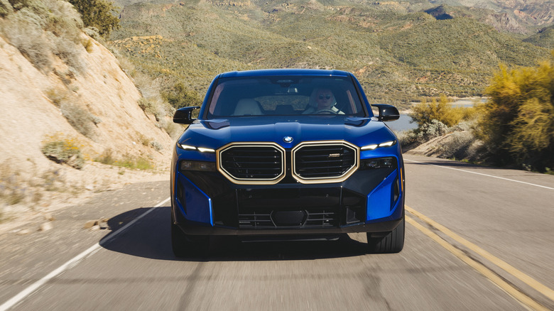 2023 BMW XM front end in blue with gold trim