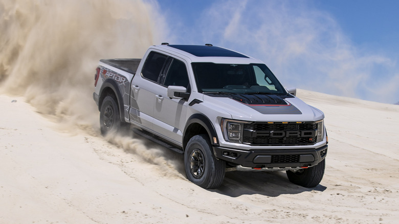 Ford Raptor driving on sand