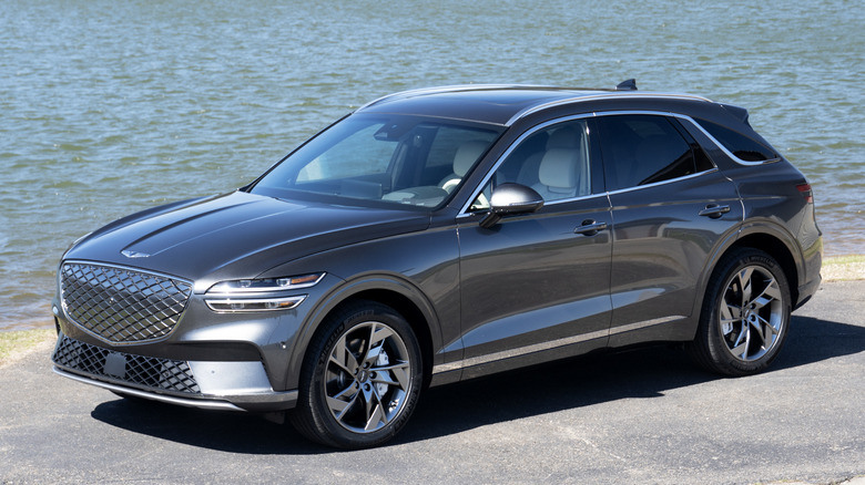 Genesis Electrified GV70 front three quarters at the lake
