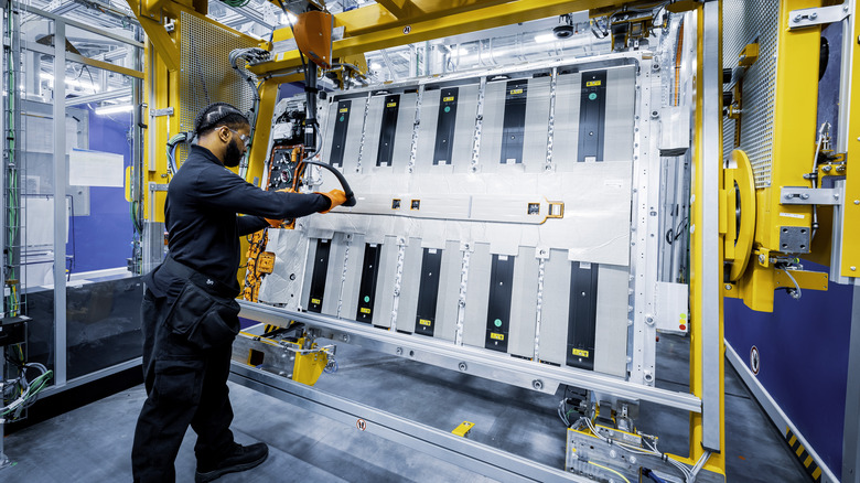 Worker finishes assembly of battery pack