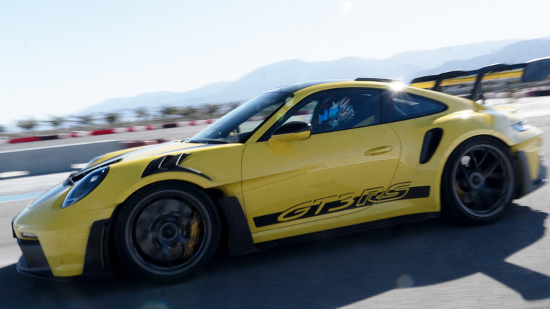 Racing Yellow 992 Porsche 911 GT3 RS in motion at The Thermal Club
