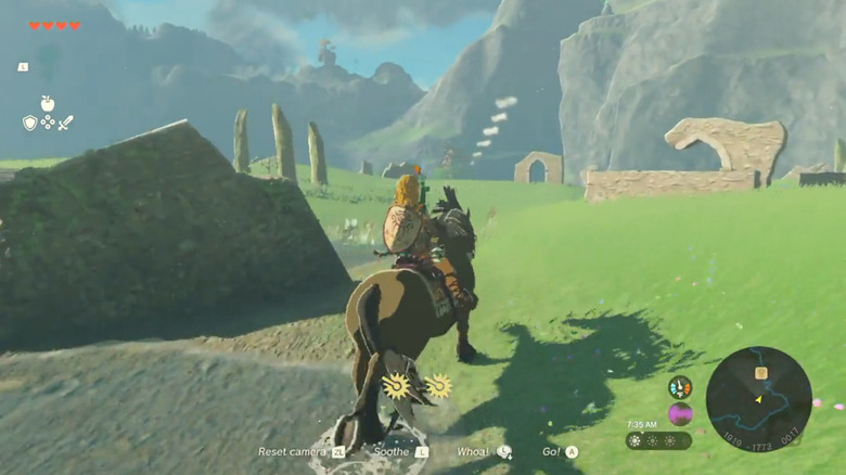 Link andando a cavalo pela grama