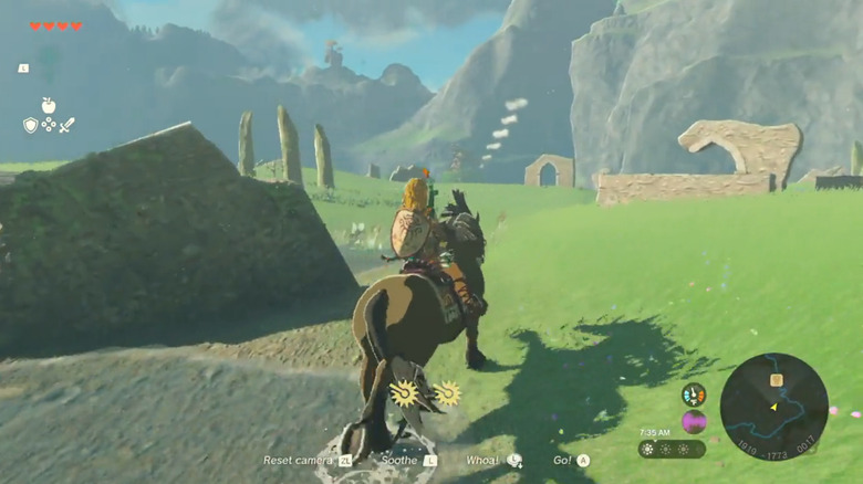 Link riding horse through grass