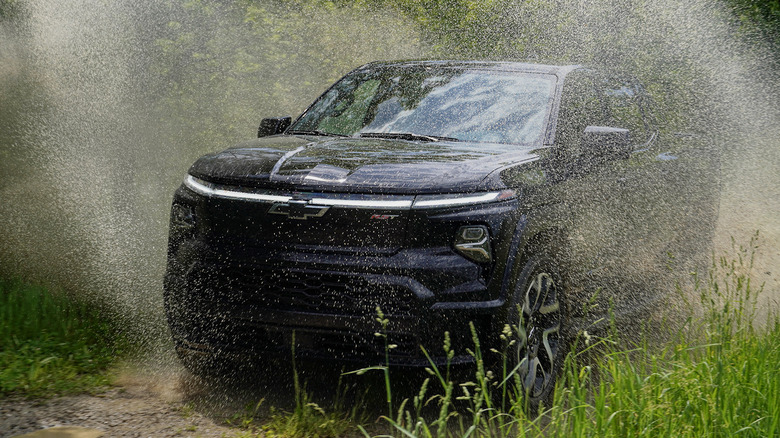 2024 Chevrolet Silverado RST First Edition splashing through puddles