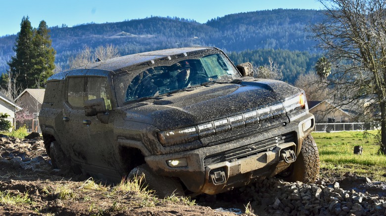 2024 GMC Hummer EV SUV off-roading.