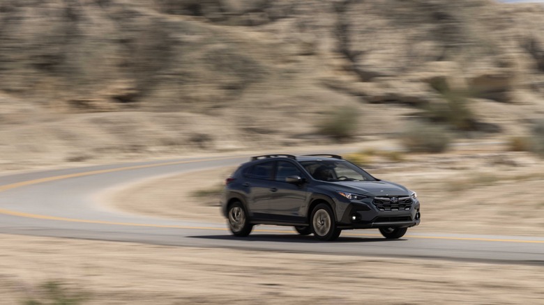 2024 Subaru Crosstrek driving on a winding road