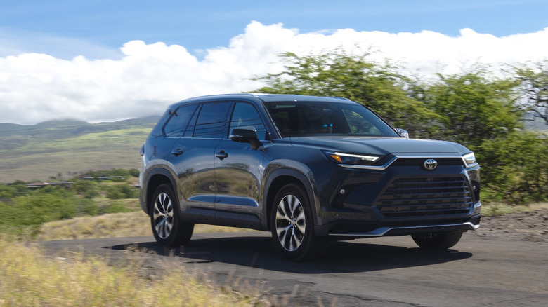 2024 Toyota Grand Highlander front three quarters driving