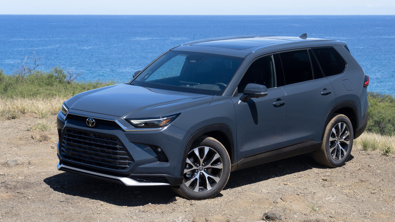 2024 Toyota Grand Highlander front three quarters at beach