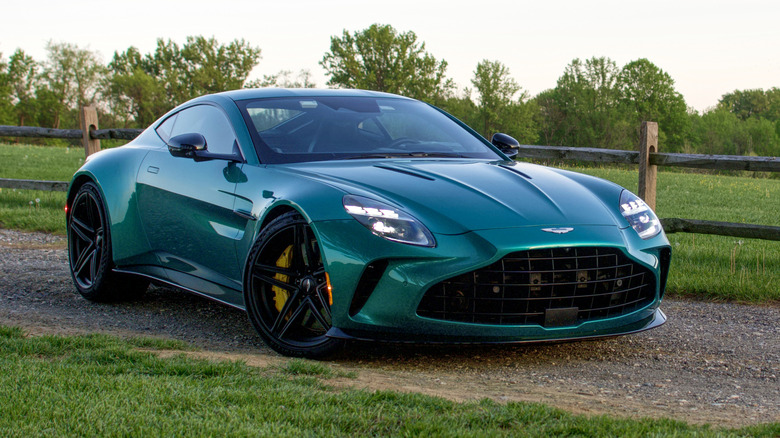 Aston Martin Vantage front 3/4 view in front of a fence