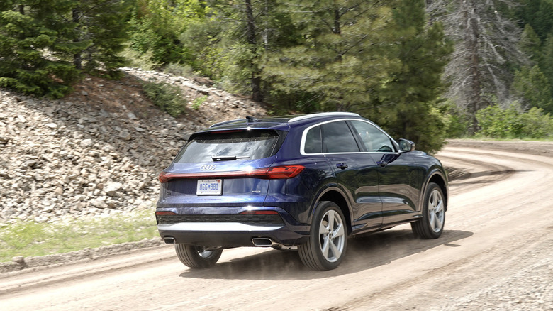 2025 Audi Q5 on a dirt road rear three-quarters