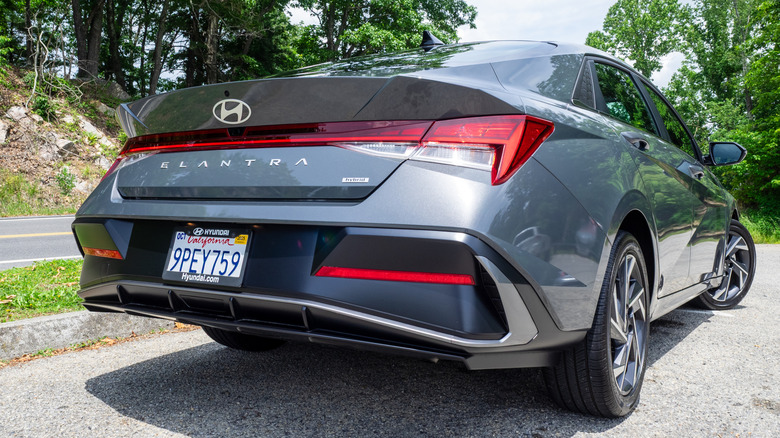 2025 Hyundai Elantra Hybrid parked next to a mountain road