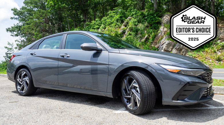 2025 Hyundai Elantra Hybrid parked next to a mountain road