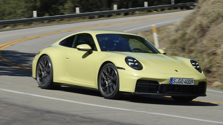 2025 Porsche 911 Carrera S in Cartagena Yellow on a mountain road