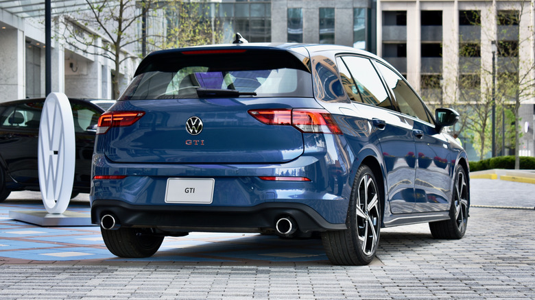 2025 Volkswagen Golf GTI rear three quarter view.