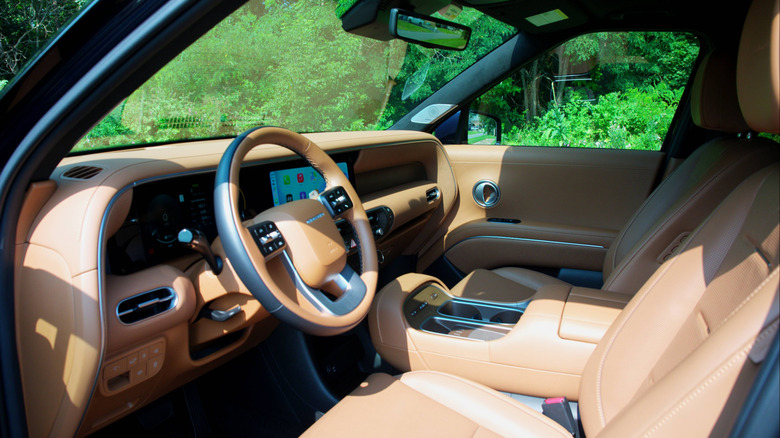 2026 Hyundai Palisade Hybrid angled left front cabin view with dashboard and steering wheel
