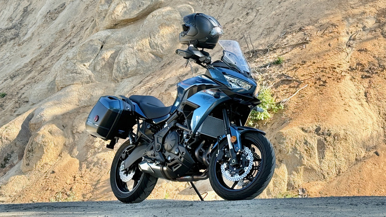 2026 Kawasaki Versys 650 parked with an Arai Corsair helmet on the handlebars