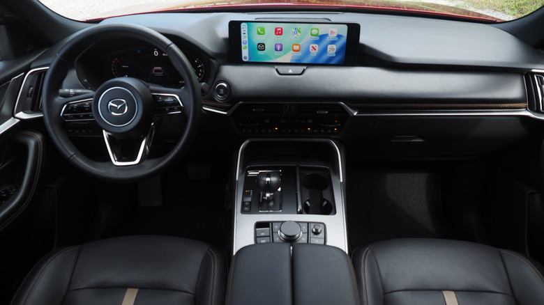 2026 Mazda CX-90 dashboard, steering wheel and center console with Apple CarPlay on the touchscreen