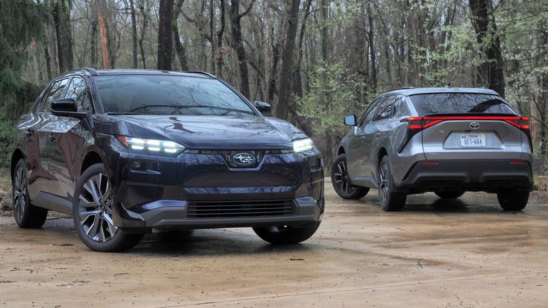 2026 Subaru Solterra facing forward and 2026 Toyota bZ facing backward