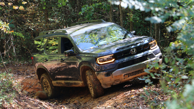 2027 Honda Passport TrailSport traverses through a rough section of the trail