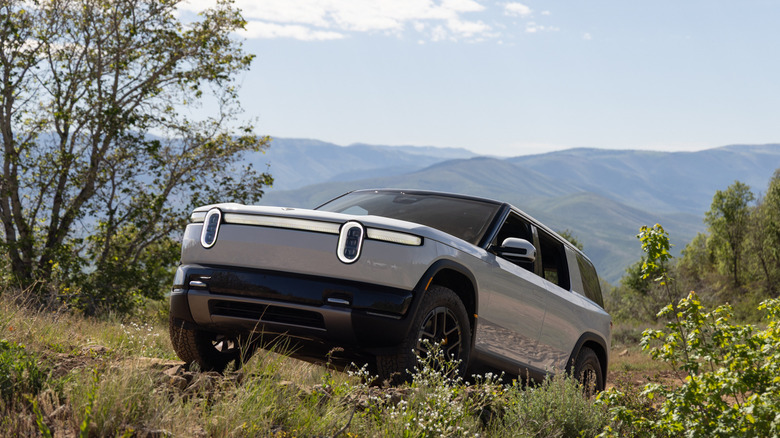 2027 Rivian R2 climbing a mountain in Utah