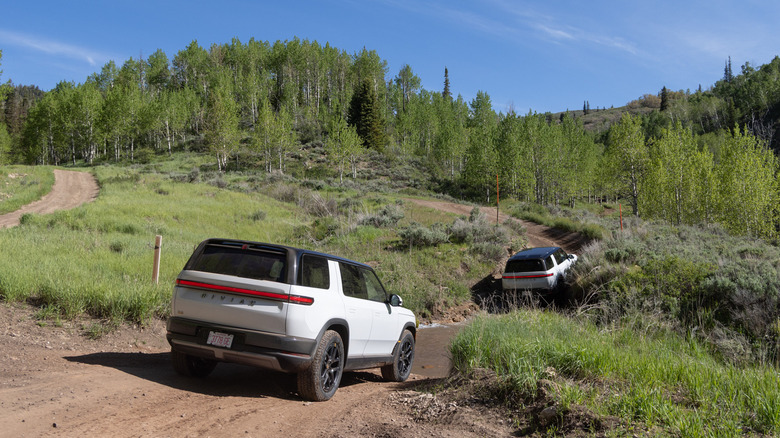 2027 Rivian R2 crossing a stream in Utah