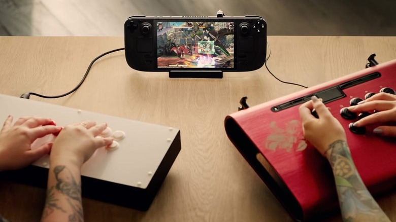 People playing Steam Deck with fight sticks