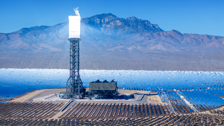 Ivanpah solar power facility with backdrop of desert mountains