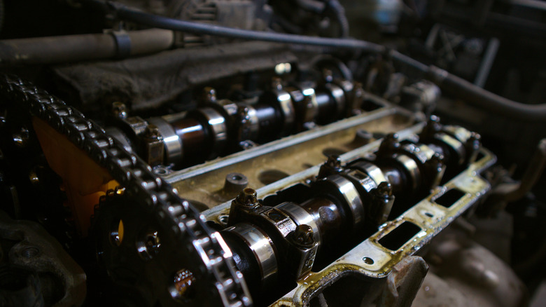 Detail view of double overhead-cam four-cylinder engine with timing and camshaft covers removed