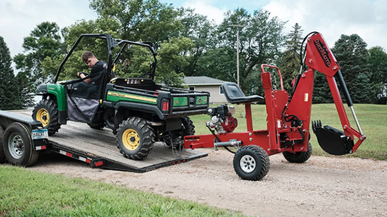 A young man towing the Kwik-Way DirtMaster