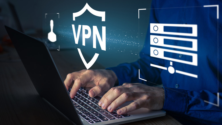 Man using a laptop with digital overlay icons representing VPN
