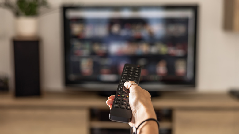 Person holding remote