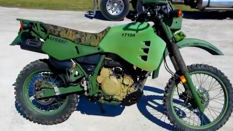 Green Kawasaki M1030-M1 parked on the road