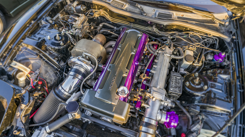 Turbocharged engine under hood of car
