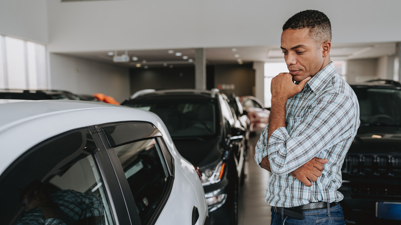 A man considering a new car