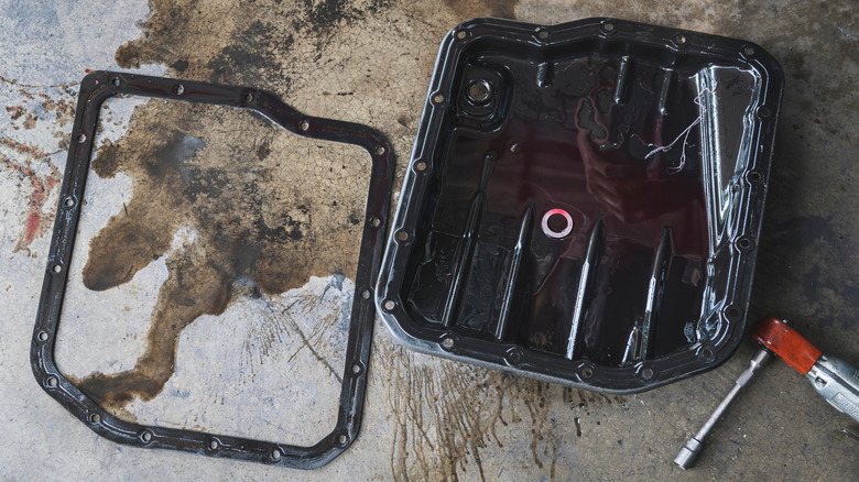 Old used car automatic transmission oil pan and gasket.