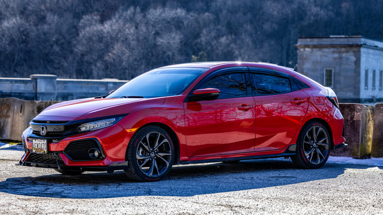 A red Honda Civic sedan on a rooftop