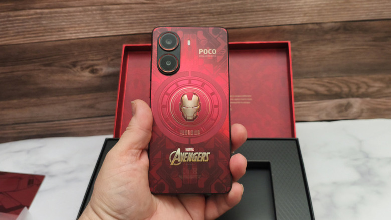 Iron Man special edition phone held in hand.