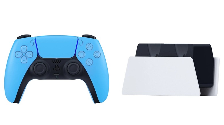Sony DualSense controller and charging dock on a white background