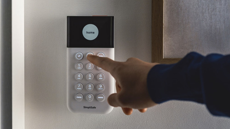 person pressing keypad