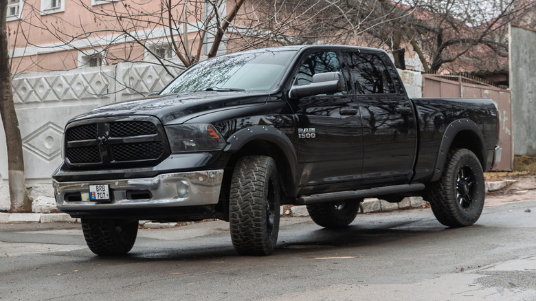 A fourth-generation Ram 1500 pickup truck on the road