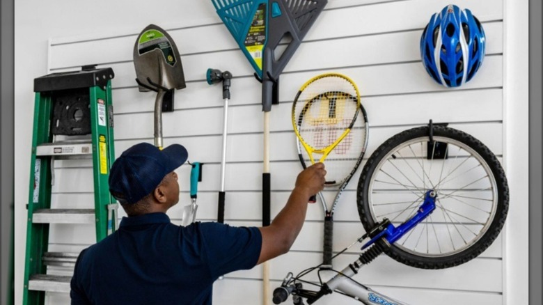 Hanging garage items on the Proslat wall with hooks.