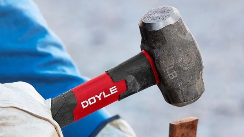 Person using Doyle 3 lb. Steel Drilling Hammer